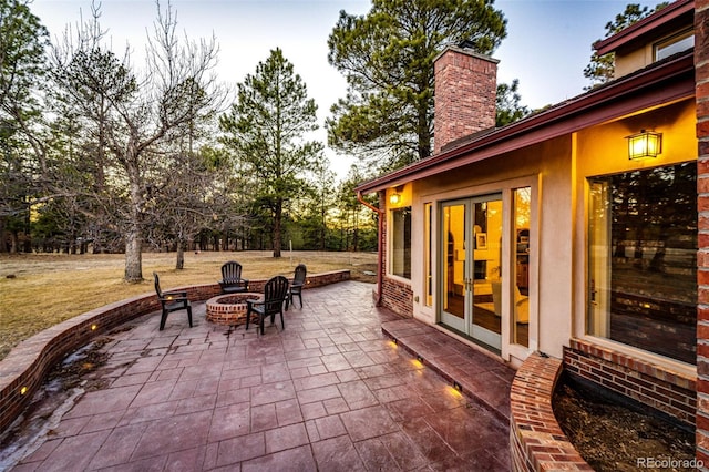 view of patio featuring french doors and an outdoor fire pit