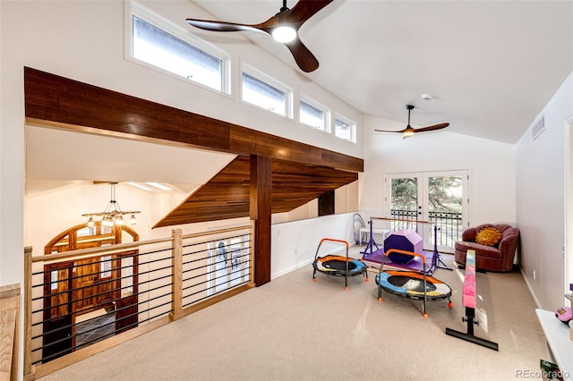 sitting room featuring french doors, carpet, visible vents, and a healthy amount of sunlight