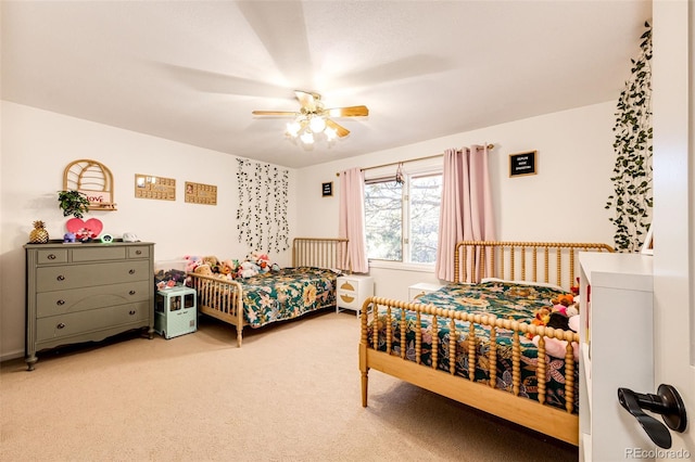 bedroom with light carpet and ceiling fan