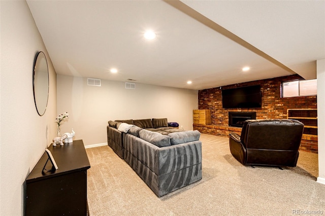 living room with a fireplace, recessed lighting, light colored carpet, visible vents, and brick wall