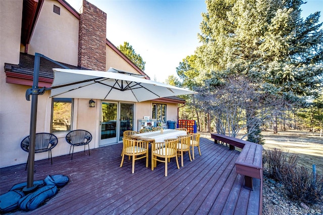 deck featuring outdoor dining area