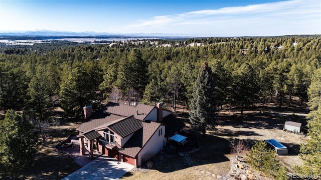 aerial view featuring a view of trees