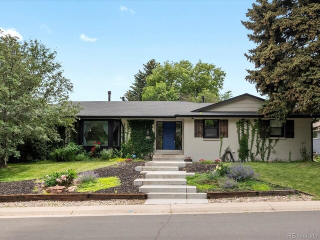 280 E 11th Ave, Broomfield, CO 80020 - single story home with brick siding and a front lawn