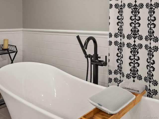 280 E 11th Ave, Broomfield, CO 80020 - bathroom view of a freestanding bath and a wainscoted wall