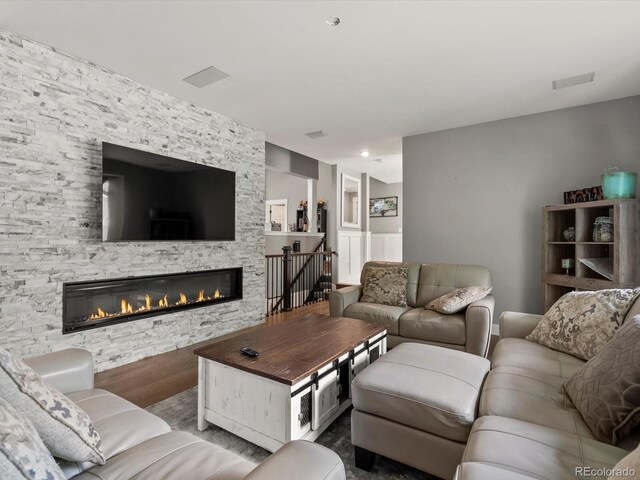 280 E 11th Ave, Broomfield, CO 80020 - living area featuring a fireplace and wood finished floors