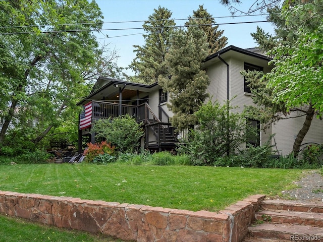 280 E 11th Ave, Broomfield, CO 80020 - back of property with a lawn, stairs, and a deck