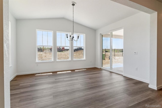 25284 E Warren Pl, Aurora, CO 80018 - unfurnished dining area with a chandelier, wood finished floors, and lofted ceiling
