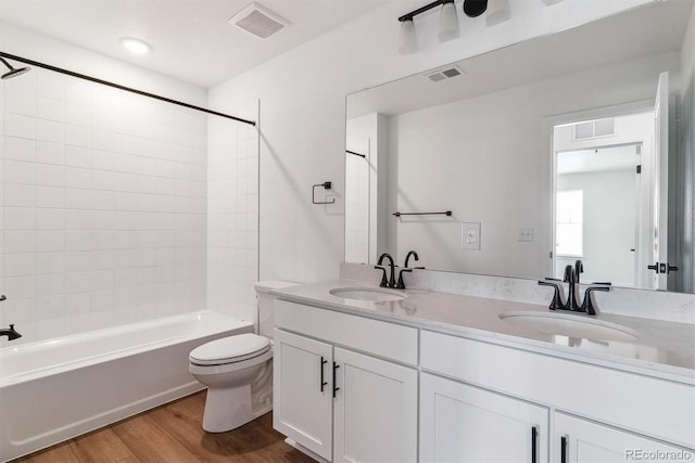 25284 E Warren Pl, Aurora, CO 80018 - full bath featuring wood finished floors, double vanity, and bathing tub / shower combination