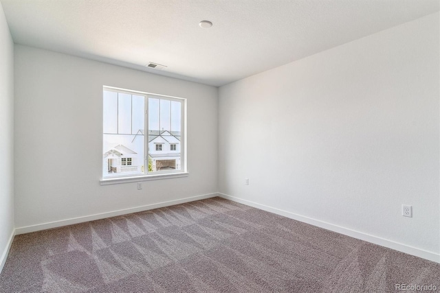 25284 E Warren Pl, Aurora, CO 80018 - carpeted spare room featuring baseboards