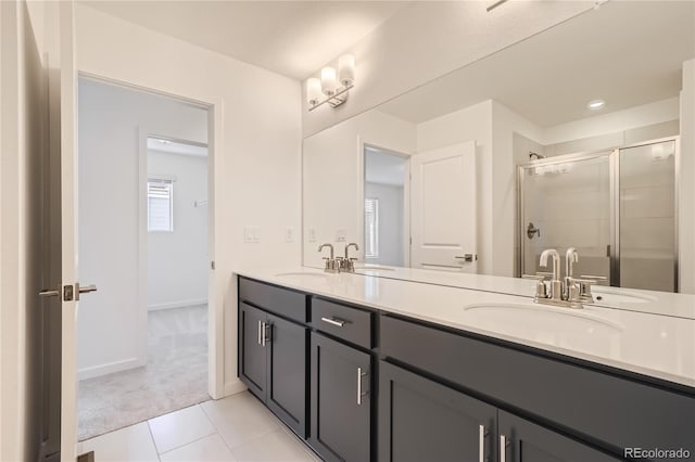 bathroom featuring tile patterned floors, walk in shower, and vanity