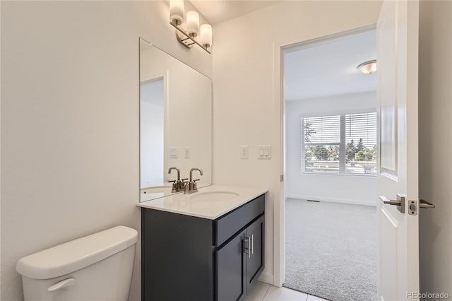 bathroom with vanity and toilet