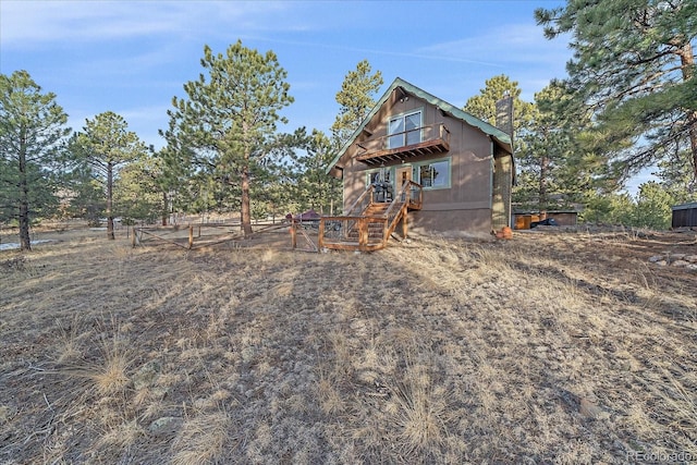 back of property featuring a chimney