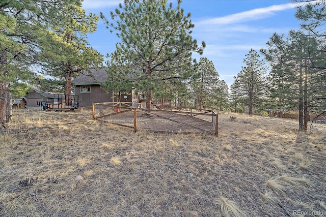 view of yard featuring a wooden deck