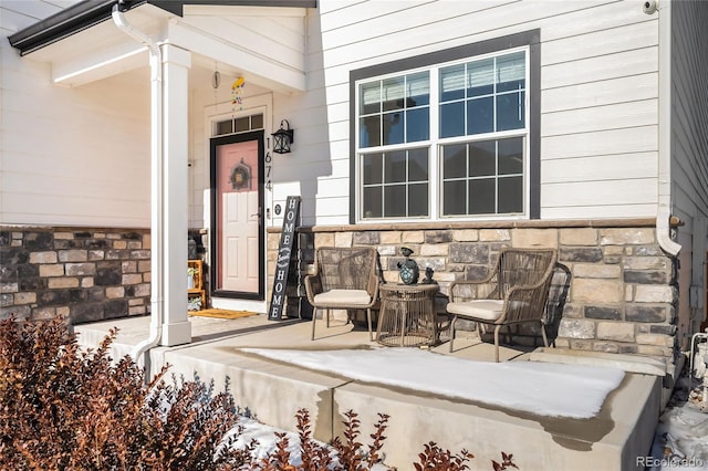 entrance to property featuring a porch