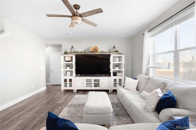 living room with dark hardwood / wood-style floors and ceiling fan