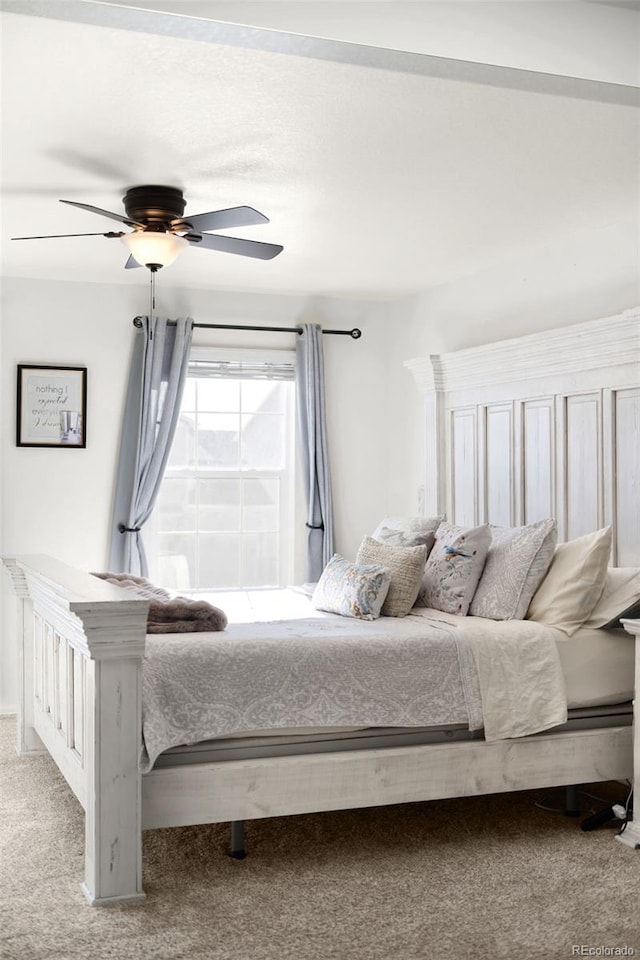 unfurnished bedroom with ceiling fan and light carpet