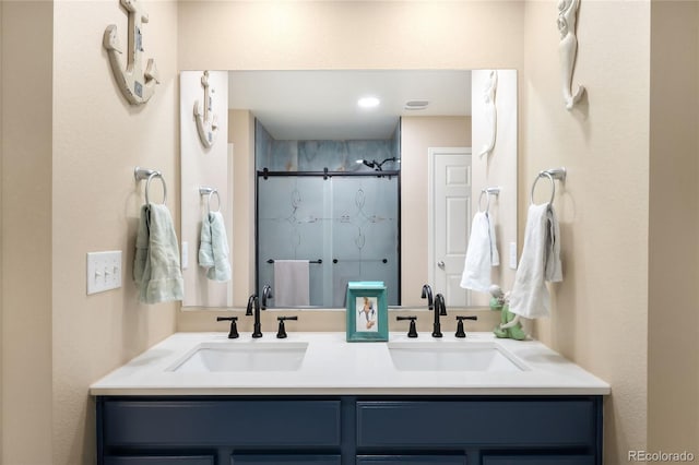 bathroom featuring vanity and a shower with shower door