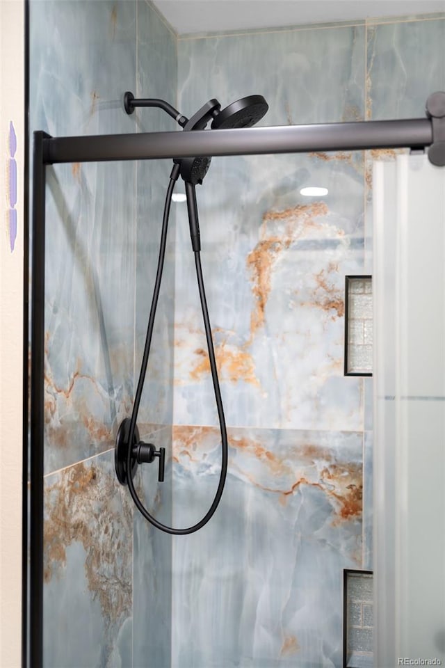 details featuring a shower with door