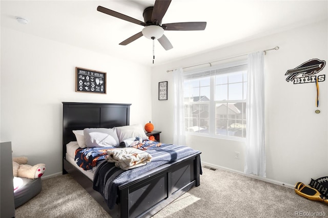 bedroom with ceiling fan and carpet