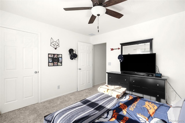 carpeted bedroom with ceiling fan