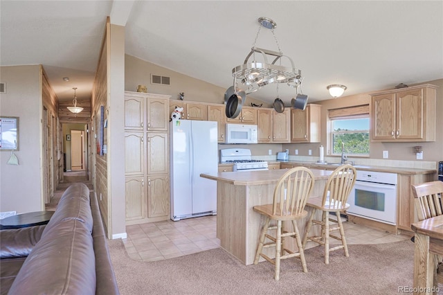 216 Rainbow Ridge Rd, Canon City, CO 81212 - kitchen featuring white appliances, light brown cabinets, light countertops, light tile patterned flooring, and lofted ceiling