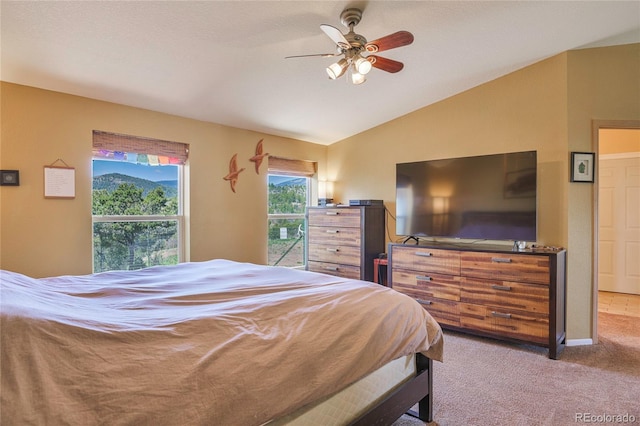 216 Rainbow Ridge Rd, Canon City, CO 81212 - bedroom featuring lofted ceiling, light carpet, and a ceiling fan