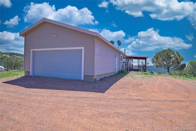 216 Rainbow Ridge Rd, Canon City, CO 81212 - view of side of home featuring dirt driveway and a garage