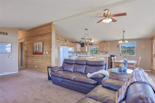 216 Rainbow Ridge Rd, Canon City, CO 81212 - living area featuring a chandelier, light carpet, ceiling fan, and wood walls