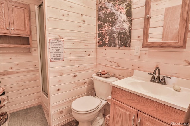 216 Rainbow Ridge Rd, Canon City, CO 81212 - full bathroom featuring a shower with shower door, wooden walls, and vanity