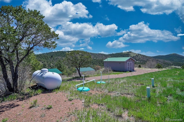 216 Rainbow Ridge Rd, Canon City, CO 81212 - view of yard featuring a shed and a mountain view