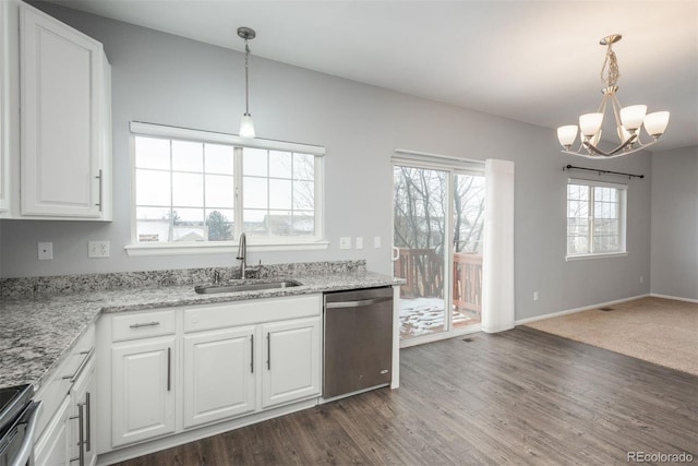 kitchen featuring sink, white cabinetry, light stone counters, hanging light fixtures, and stainless steel appliances