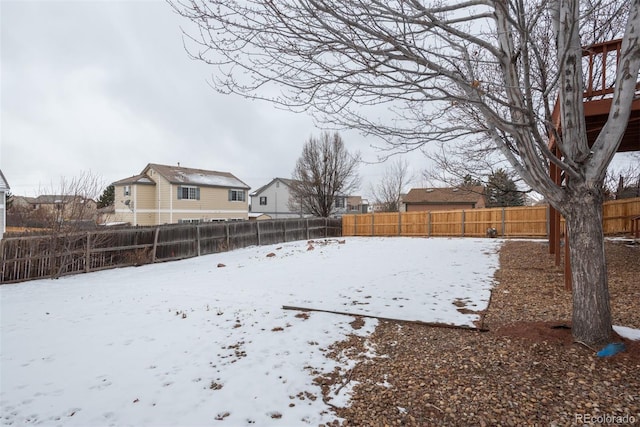 view of yard layered in snow