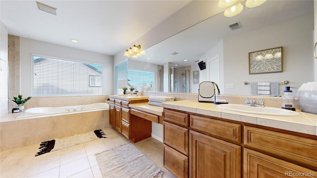 bathroom featuring tile patterned flooring, vanity, and independent shower and bath