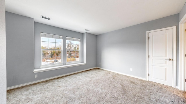 unfurnished room with carpet flooring