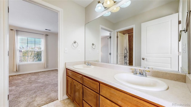 bathroom with tile patterned floors and vanity