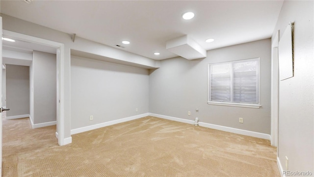 basement with light colored carpet