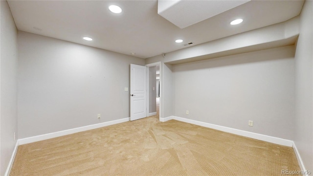 spare room with light colored carpet