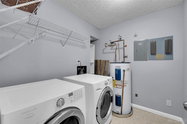 laundry room with electric water heater, washing machine and clothes dryer, light tile patterned floors, electric panel, and baseboards