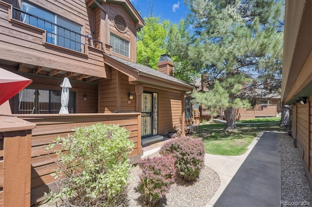 entrance to property with a chimney