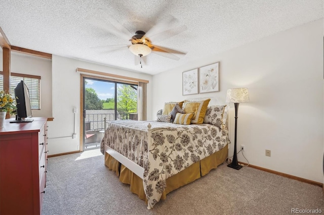 bedroom featuring access to exterior, multiple windows, baseboards, and a textured ceiling