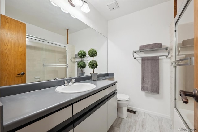 full bathroom with marble look tiles, toilet, vanity, baseboards, and combined bath / shower with glass door