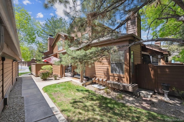 8010 Holland Ct Unit D, Arvada, CO 80005 - back of house with a chimney