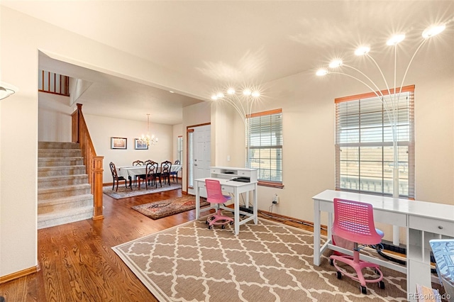 interior space featuring hardwood / wood-style flooring and a chandelier