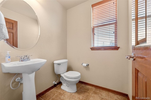 bathroom with sink and toilet