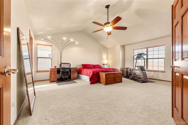 carpeted bedroom with ceiling fan and lofted ceiling