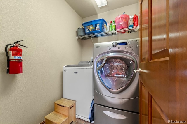 laundry room featuring washing machine and dryer