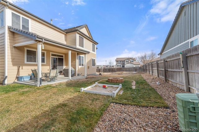 exterior space featuring a patio area and an outdoor fire pit