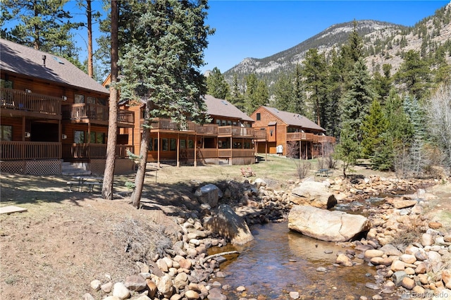 1400 David Dr Unit 1, Estes Park, CO 80517 - view of yard featuring a deck with mountain view