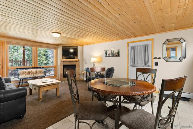1400 David Dr Unit 1, Estes Park, CO 80517 - dining room featuring a tiled fireplace and wood ceiling