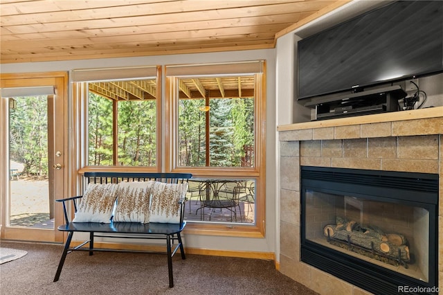 1400 David Dr Unit 1, Estes Park, CO 80517 - sitting room with wooden ceiling, carpet, and a tile fireplace